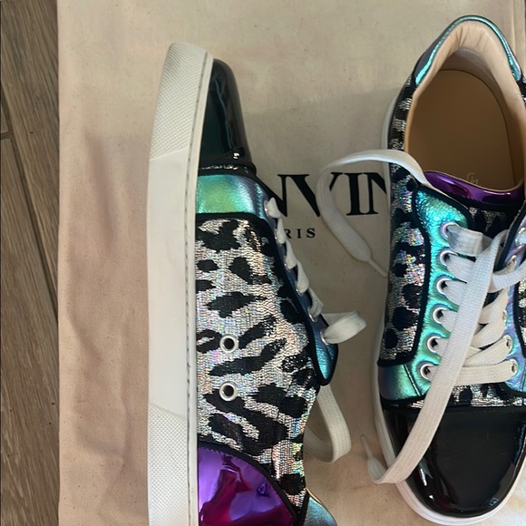 Black & Purple Women's Sneakers
made in Paris by Christian LOUBOUTIN
Red bottom - Picture 12 of 16